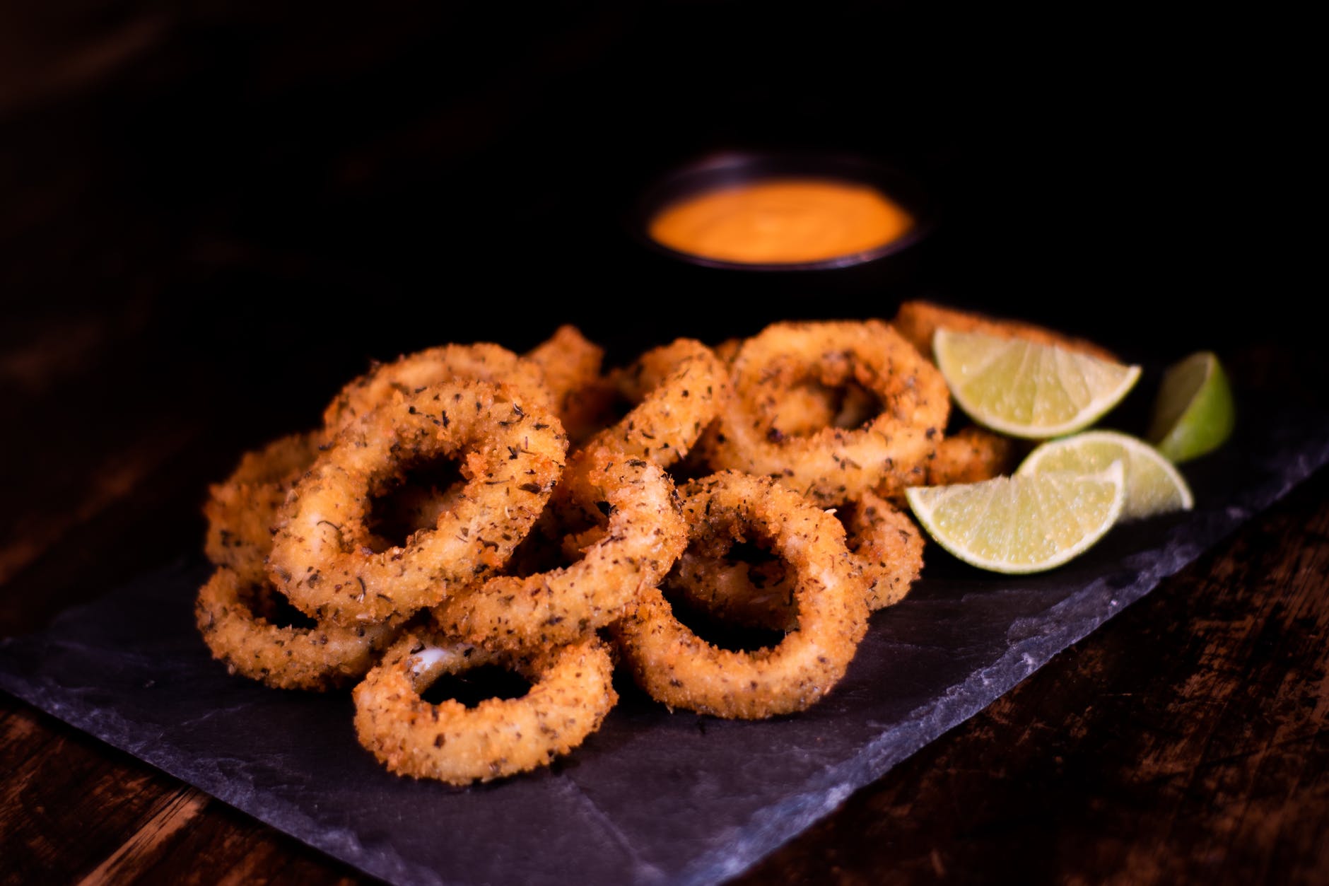 fried onion rings and slices of lime