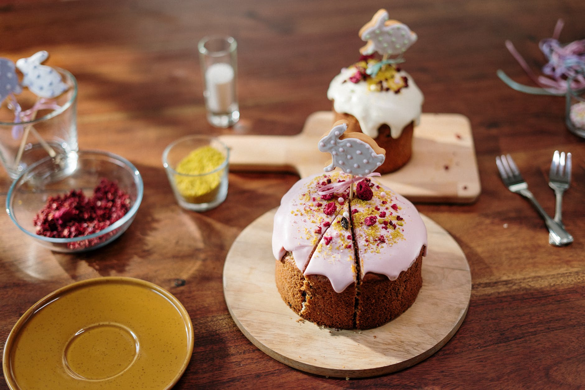 chocolate cake with white icing on brown wooden round tray